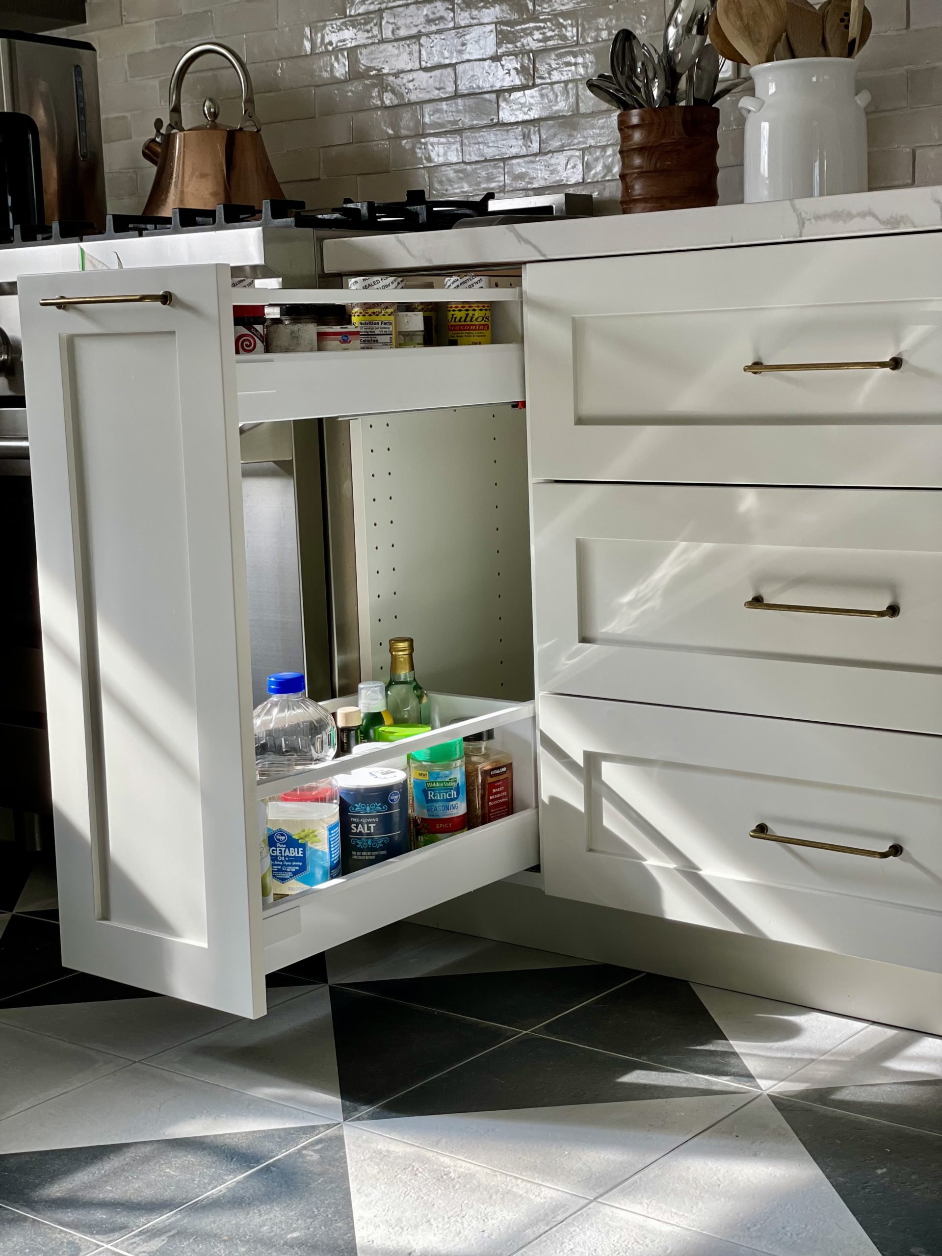 after kitchen renovationikea storage hidden drawers after kitchen renovation, quartz counters calacatta laza, benjamin moore paint winds breath